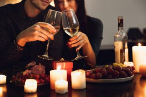 Romantic date night with wine, candles, and grapes
